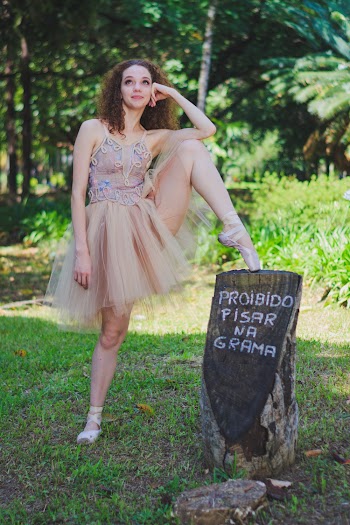 Woman Stepping on Tree Log