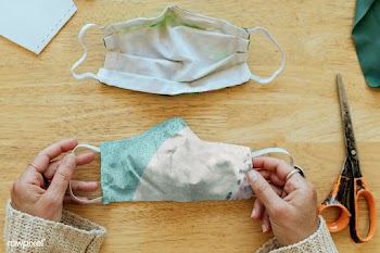 Woman stitching a face mask during the coronavirus pandemic | Free  photo - 2329913