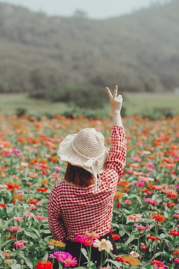 Woman Surrounded by Flowers