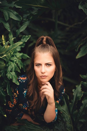 Woman Surrounded By Green Plants
