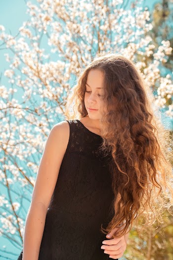 Woman Surrounded by White Leafed Tree