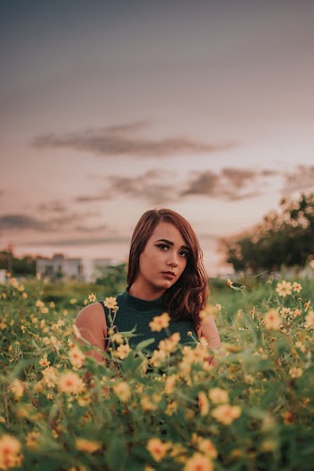 Woman Surrounded By Yellow Petaled Flowers