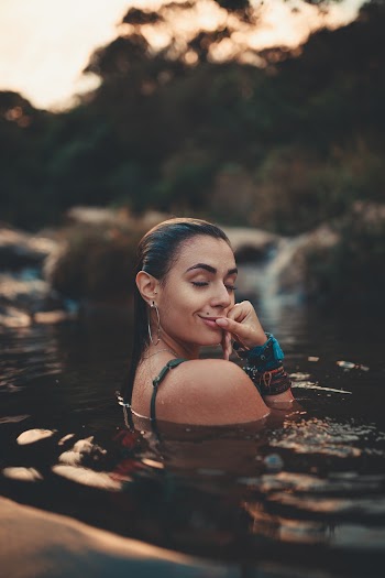 Woman Swimming In Body Of Water