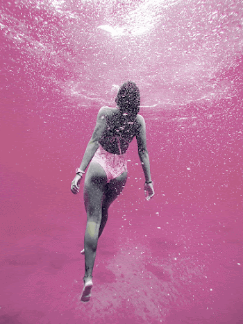 Woman swimming in pink water, | Free Photo - rawpixel