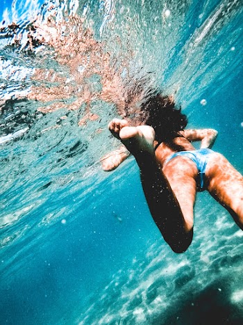 Woman Swimming Underwater