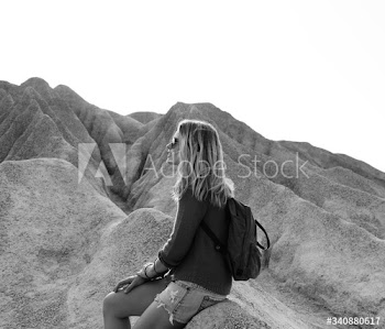 Woman take a rest from hiking on the rock