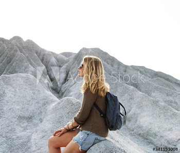 Woman take a rest from hiking on the rock