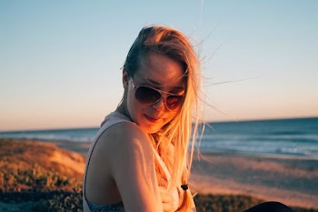 woman taking a selfie at the shore