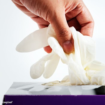 Woman taking disposable gloves from the box   | Free  photo - 2302272