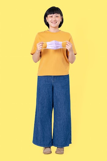 Woman taking mask off during the new normal | Free stock photo | High Resolution image