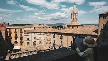 Woman Taking Photo of Building