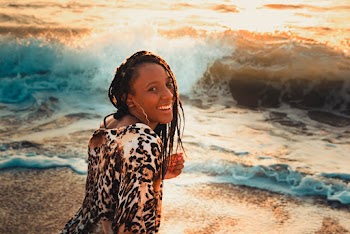 Woman Taking Picture Beside Beach