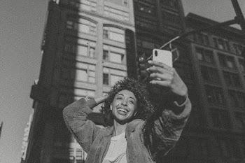 Woman taking selfie in city in black and… | Free stock photo | High Resolution image