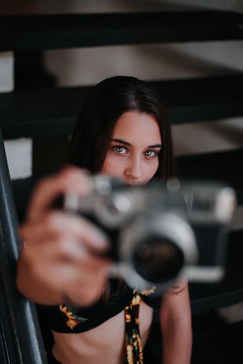 Woman Taking Selfie Using Camera