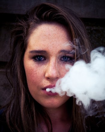 Woman Taking Selfie While Smoking