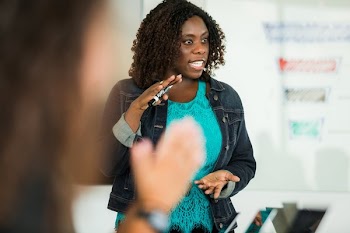 Woman Talking During Meeting