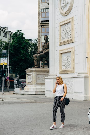 Woman Talking on the Phone Crossing the Street