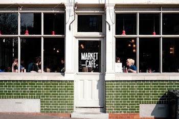 woman talking to man infront of window