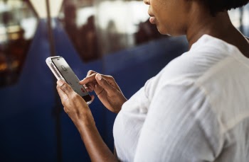 Woman Tapping on Phone