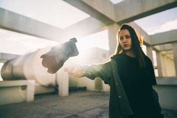 woman threw DSLR camera on roof of building