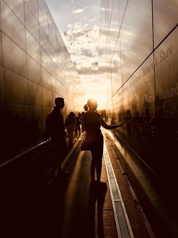 Woman Touching a Black Wall