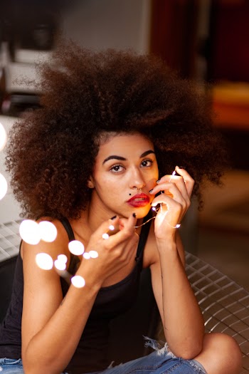 Woman Touching Face With Own Hand