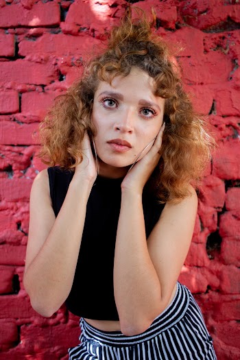 Woman Touching Her Cheek