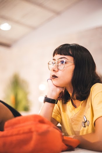Woman Touching Her Chin Using Her Right Hand