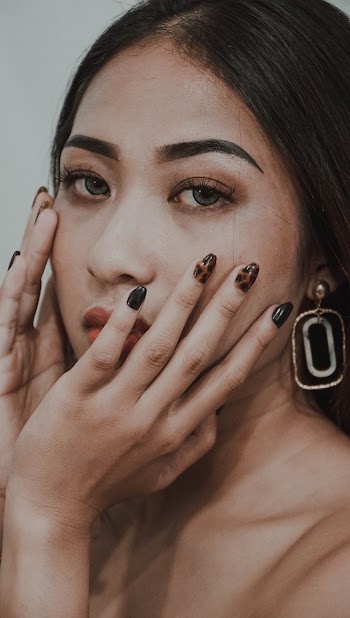 Woman Touching Her Face