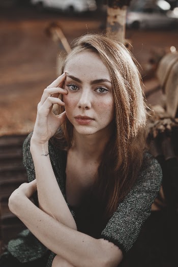 Woman Touching Her Face