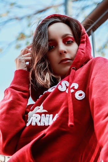 Woman Touching Her Hoodie