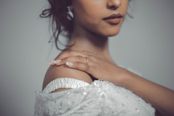 Woman Touching Her Shoulder
