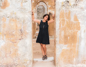 Woman Touching Wall While Taking Photo