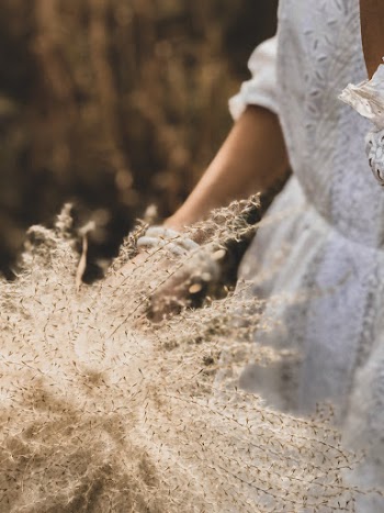 Woman Touching Wild Flowers