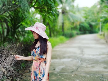 Woman Touching Withered Plant