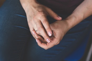 Woman tries on her diamond engagement ring