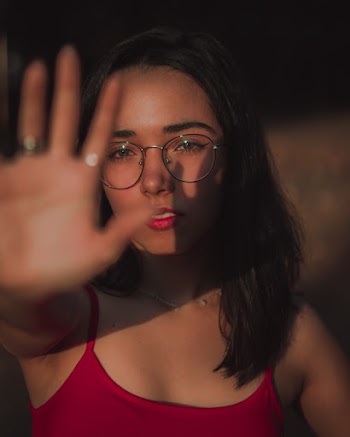 Woman Trying to Cover Her Face With Her Right Hand