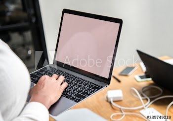 Woman using a laptop in a meeting