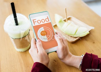 Woman using a phone in a melon cafe