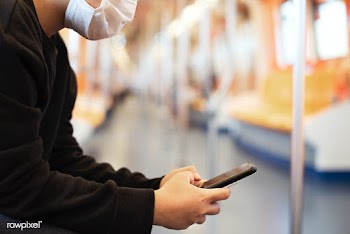 Woman using a phone on an empty train during coronavirus pandemic | Free  photo - 2293511