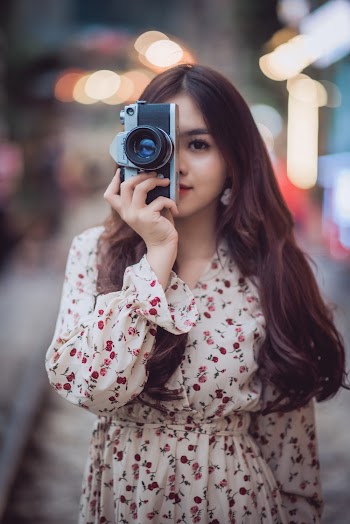 Woman Using Black and Gray Dslr Camera