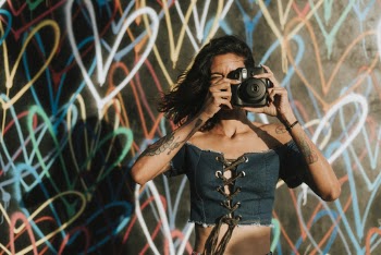 Woman Using Black Camera