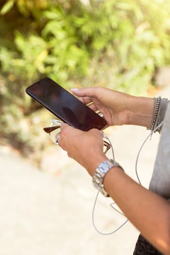 Woman Using Black Iphone 7at Daytime
