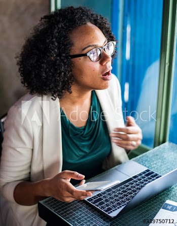 Woman using digital devices at the cafe