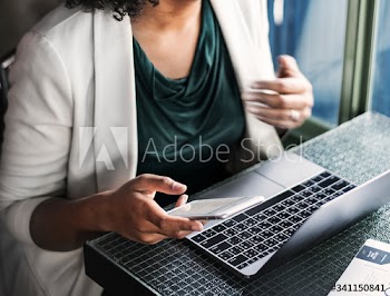 Woman using digital devices at the cafe