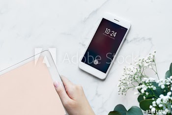 Woman using digital tablet and smartphone feminine and girly concept