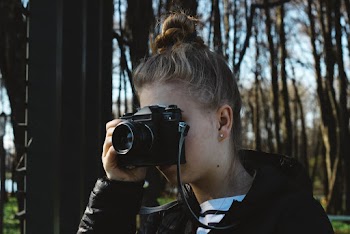 Woman Using Film Camera