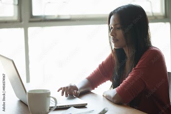 Woman using laptop at home