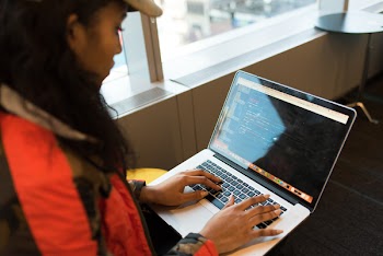 Woman Using Macbook Pro
