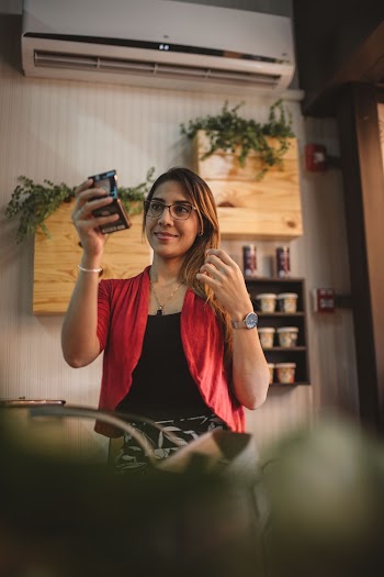 Woman Using Mirror Near Split-type Ac